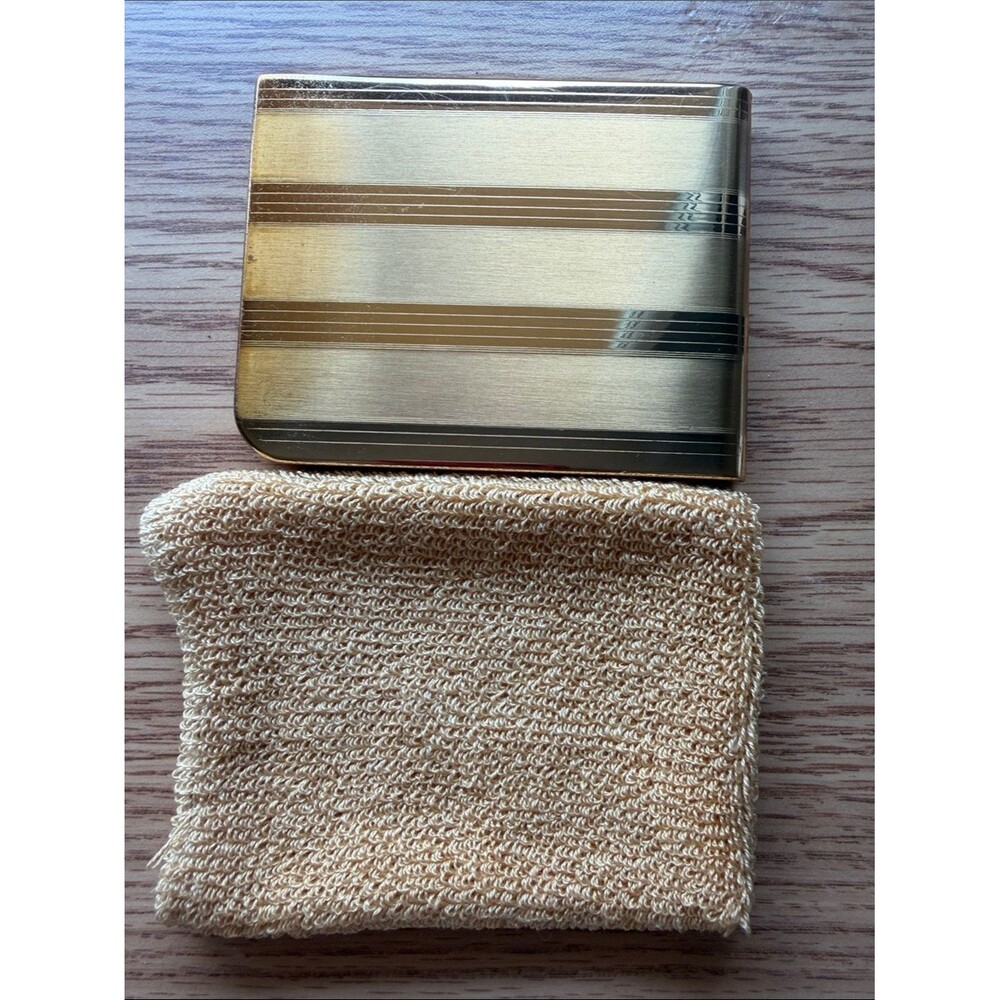 Vintage Elgin American cigarette case features a striking striped gold pattern